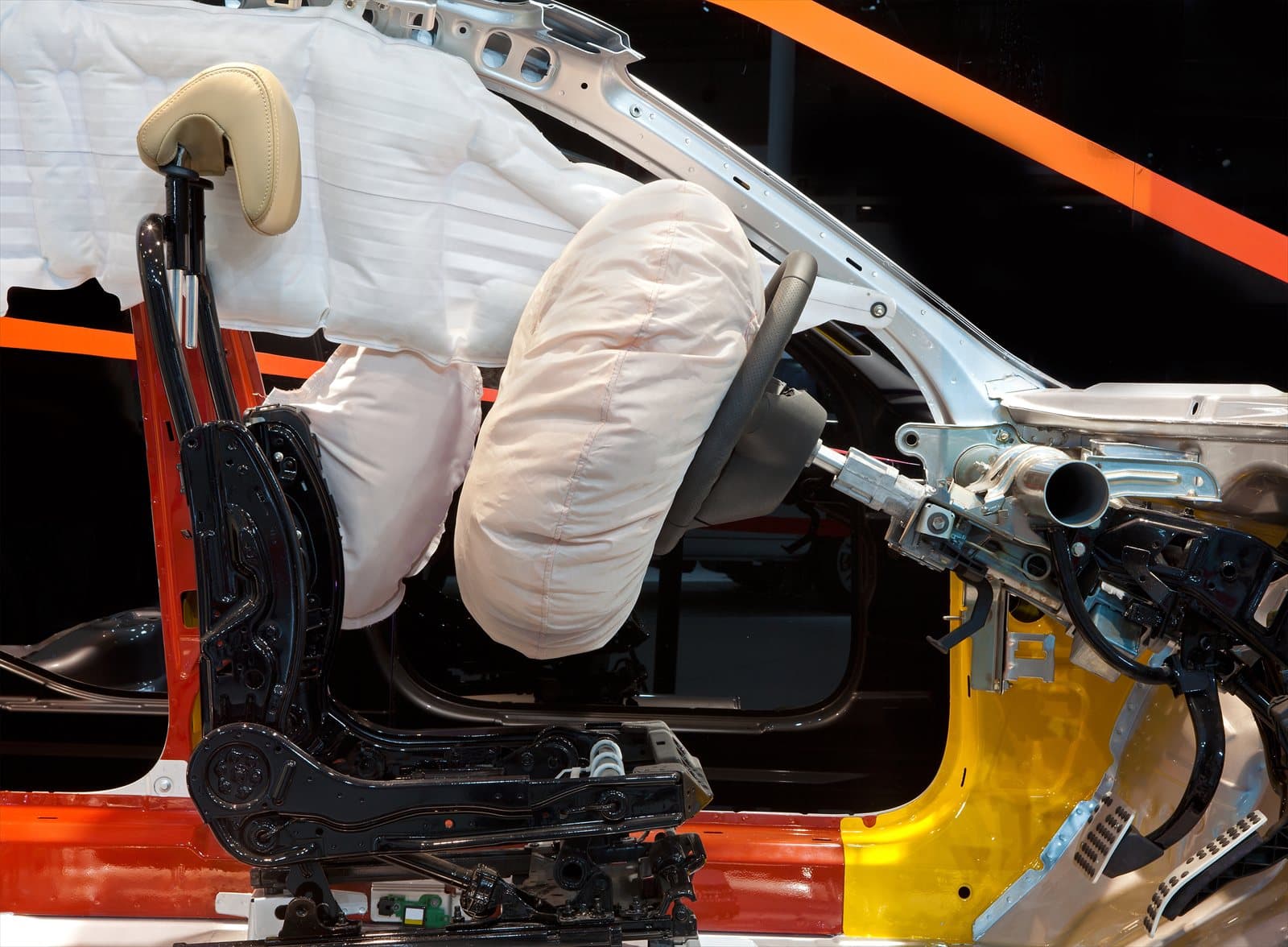 Vehicle cutaway with deployed side and curtain airbags
