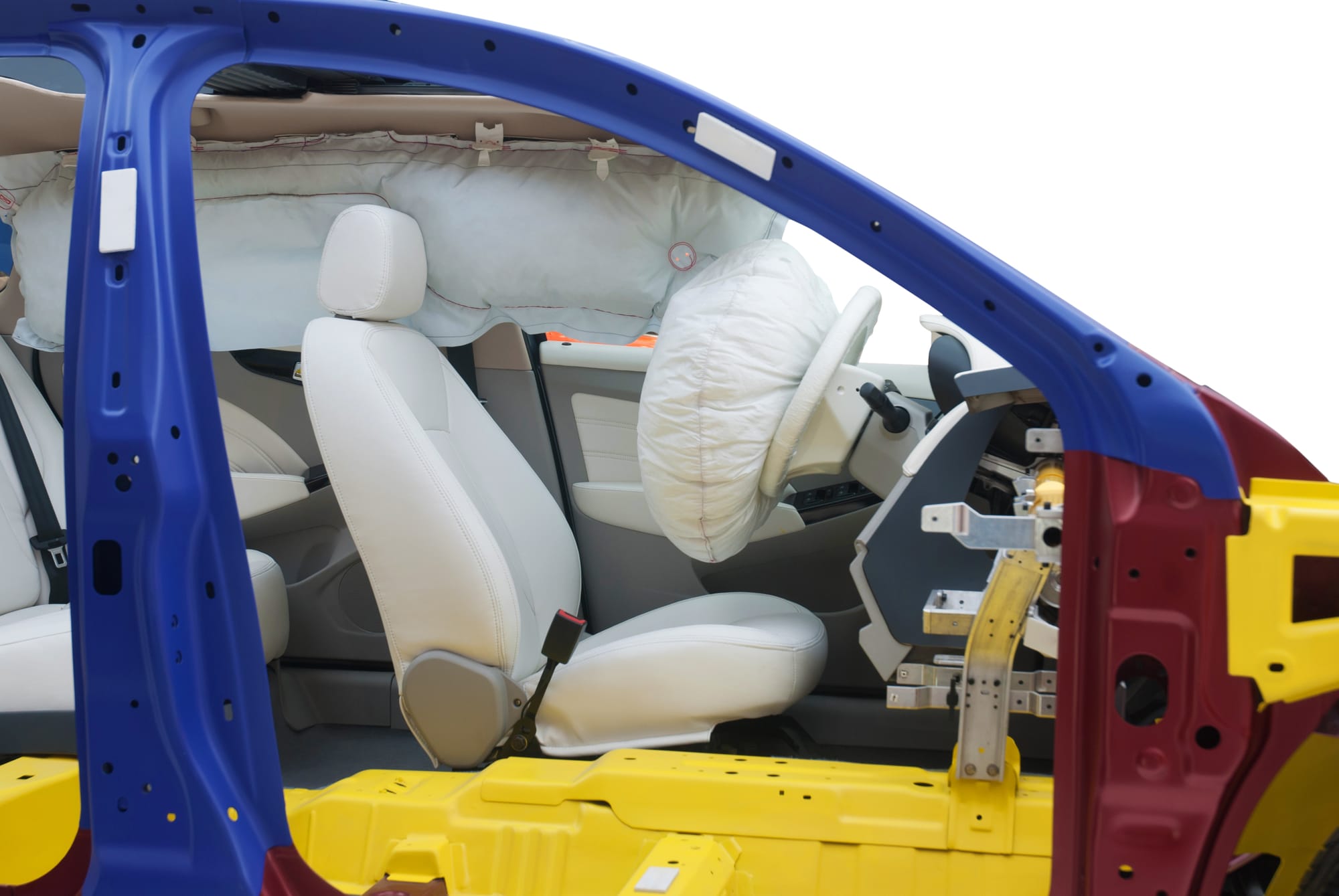 Vehicle cutaway with deployed steering-wheel and curtain airbags