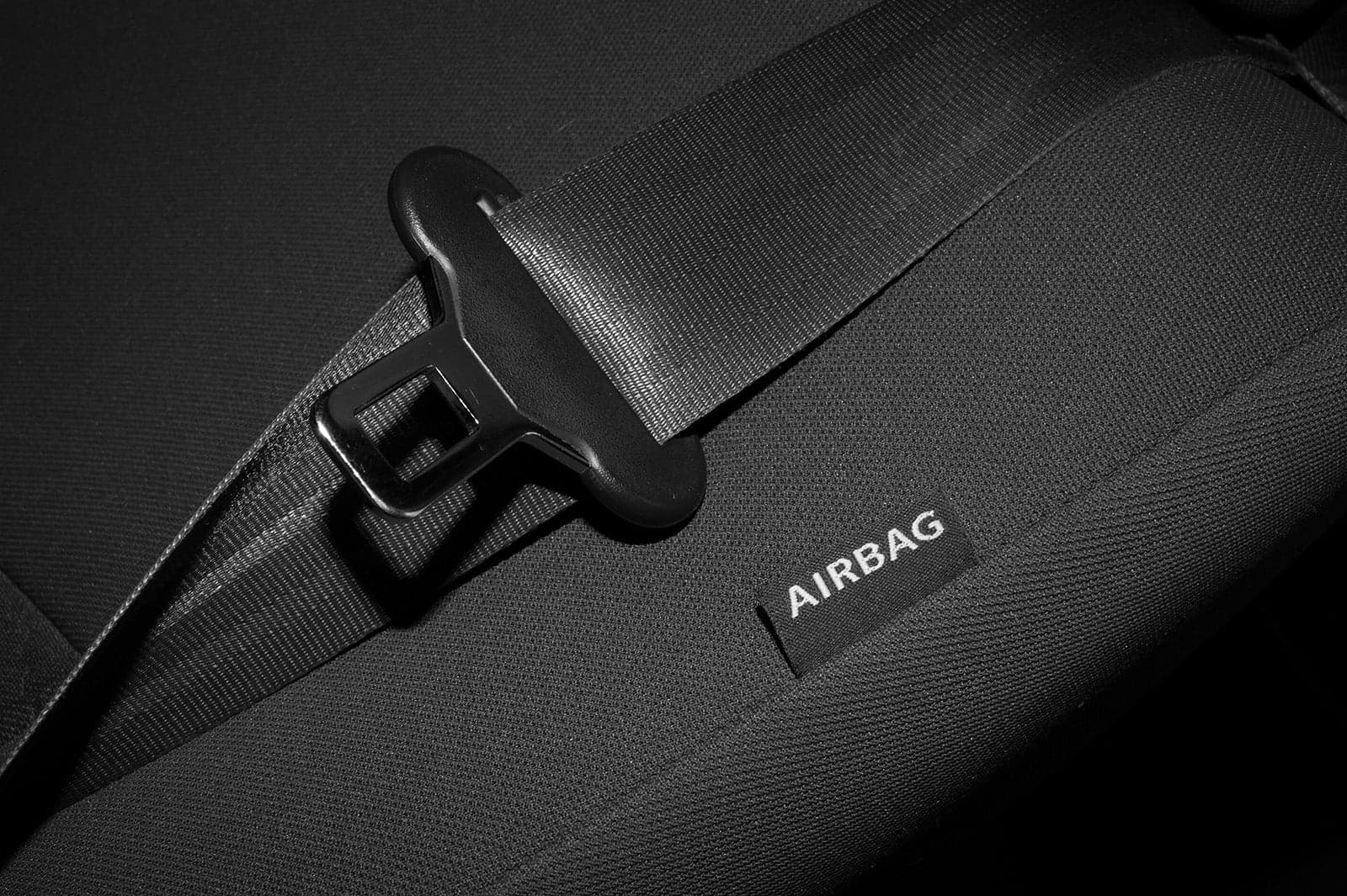 Label by a vehicle seat with an airbag